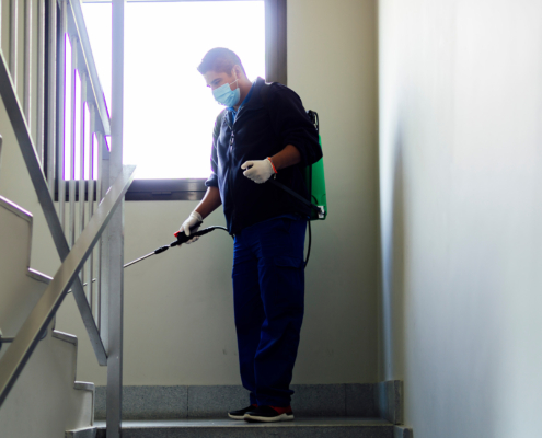 coronavirus. maintenance personnel disinfecting to prevent the spread of covid19