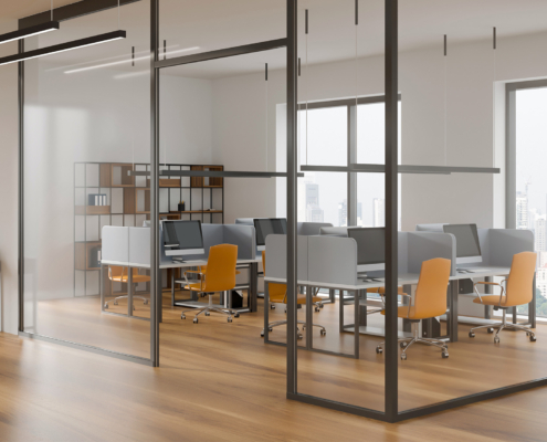 Contemporary office interior with orange chairs and computer desks